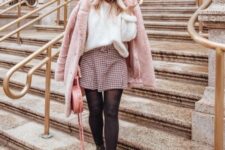 With white loose sweater, checked belted mini skirt, black tights, black leather boots and pale pink leather rounded bag