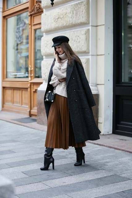 With white turtleneck sweater, brown pleated midi skirt, black leather bag and black leather high boots