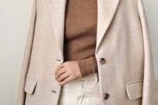 a beautiful and simple winter work look with a brown turtleneck, white jeans, a neutral oversized blazer is a stylish idea