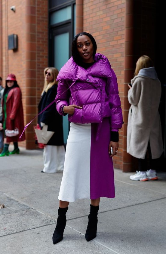 a beautiful cropped purple puffer jacket, a color block midi skirt, black sock boots are great for winter