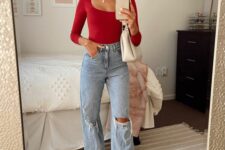 a casual holiday look with a red long sleeve top, blue ripped jeans, creamy boots and a matching bag