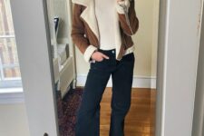a cool winter look with a creamy turtleneck, black jeans, neutral sneakers, a brown shearling jacket