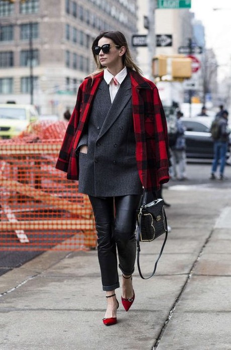 a gorgeous work outfit with black leather trousers, a white shirt, a black oversized blazer, red shoes and a red plaid coat