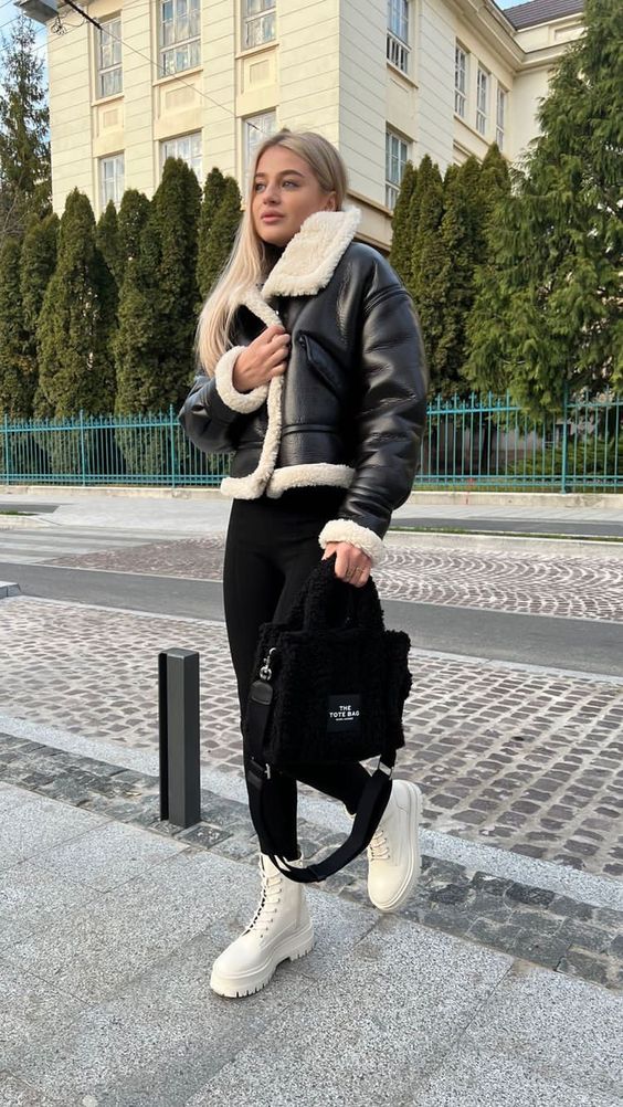 a monochromatic winter look with a black turtleneck and leggings, creamy boots, a black aviator and a black bag