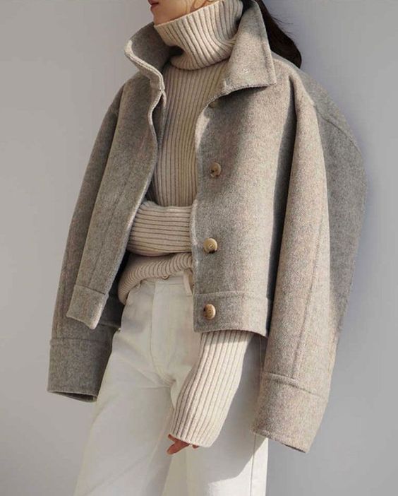 a tan turtleneck, white jeans, a grey cropped jacket are all you need for an ultimate minimalist winter look