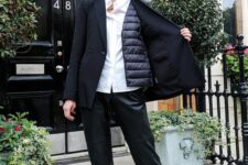a white shirt, a quilted vest under an oversized black blazer, black leather pants and two-tone shoes are perfect for work