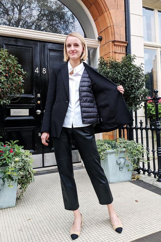 a white shirt, a quilted vest under an oversized black blazer, black leather pants and two-tone shoes are perfect for work