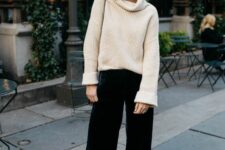 a white sweater, dark green velvet pants, nusde shoes and a bag are a cool holiday look