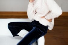 a white sweater, navy velvet pants, white cowboy boots and statement earrings are a lovely combo for Christmas