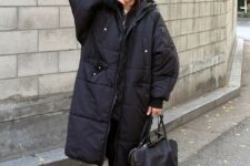 an oversized black puffer coat is a great idea for those who love trends but wants to adapt them for themselves