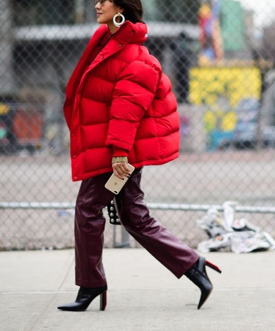an oversized red puffer jacket is a hot statement this winter