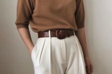 Look with a brown three quarter sleeved turtleneck, a brown leather belt and white pants