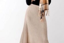 With beige, brown and black checked fringe scarf and black leather low heeled ankle boots