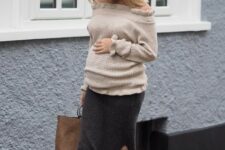 With beige off the shoulder ruffled sweater and light brown tote bag