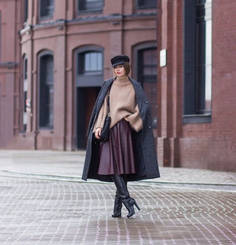 With black cap, gray midi coat, black leather bag and black leather high boots