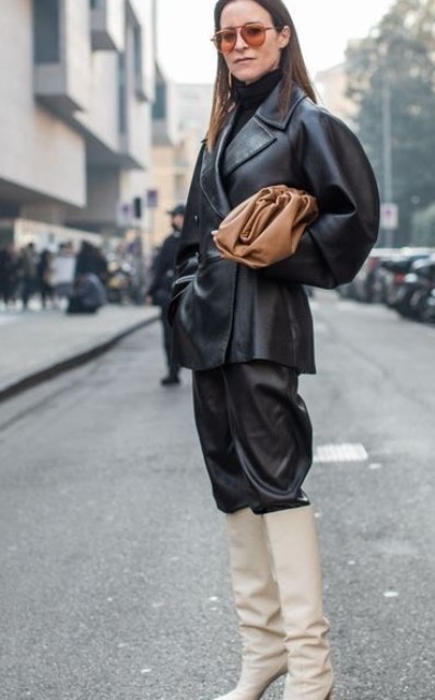 With black turtleneck, sunglasses, brown leather clutch and white leather high boots