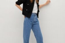 With blue wide leg jeans and black leather shoes