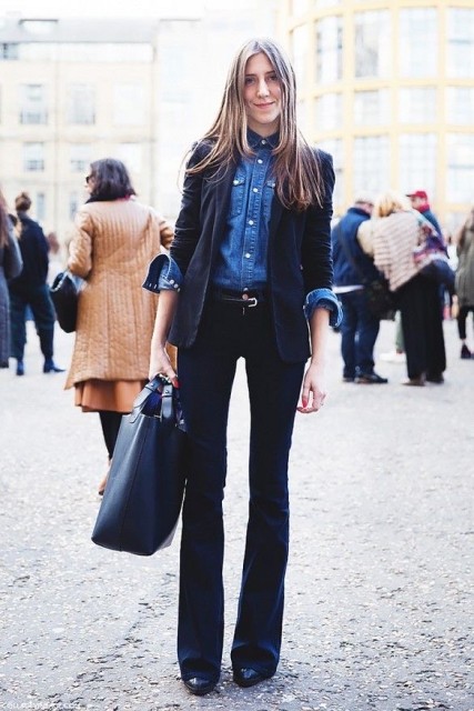 With denim button down shirt, belt, blue leather tote bag and black patent leather boots
