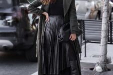 With sunglasses, black shirt, dark gray belted knee-length coat and black leather clutch