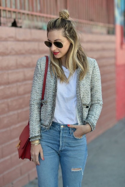 With sunglasses, blue distressed skinny jeans and marsala leather bag