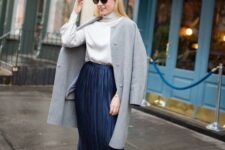 With sunglasses, gray collarless knee-length coat and beige leather pumps