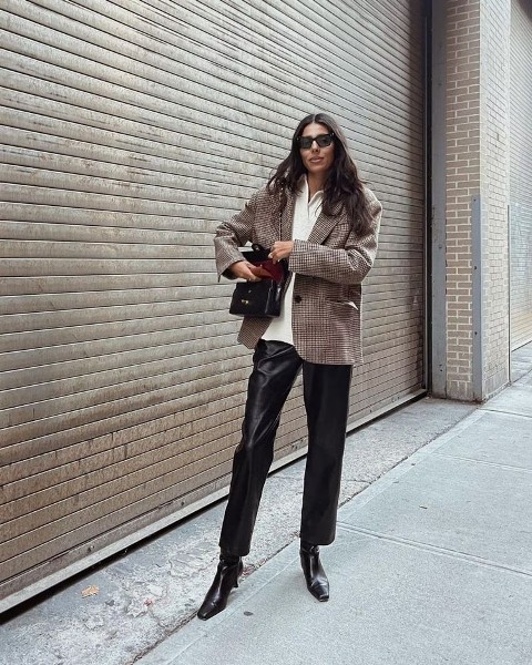 With white sweater, sunglasses, black leather chain strap bag and black leather low heeled boots