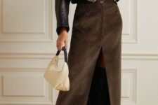 With white t-shirt, black leather crop jacket and beige and black leather bag