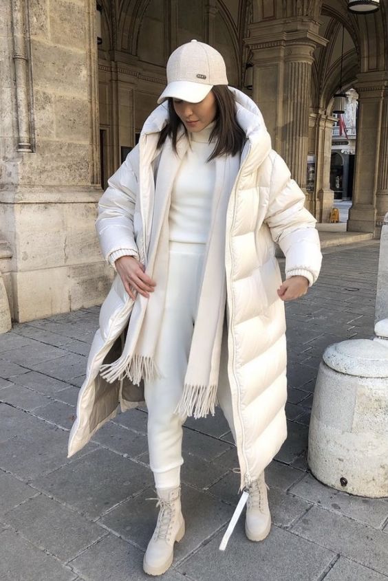 a creamy winter look with a turtleneck, sweatpants, boots, a puffer coat, a scarf and a cap looks dreamy