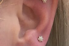 a curated ear with a flat, stacked lobe and high lobe piercing, with studs and hoops is a very stylish solution