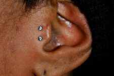 a lobe and double tragus piercing done with studs and an earring are a great idea