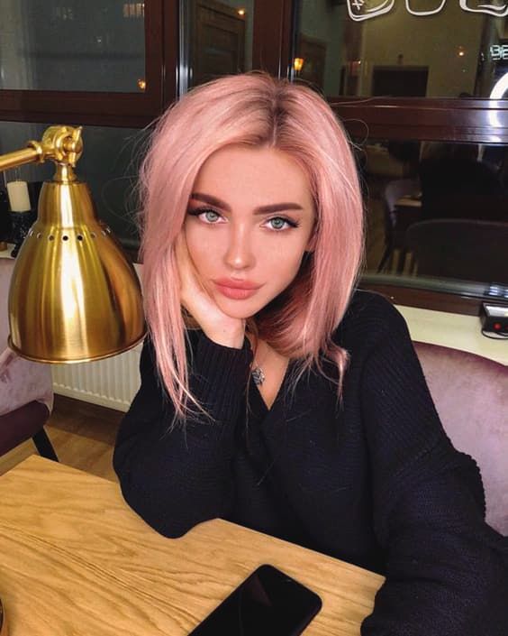 a pastel pink long bob is a gorgeous idea, here blue eyes create a perfect contrast to the pink hair