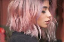 a short wavy bob with a dark purple root and pastel pink hair is a lovely idea if you wanna rock a classic haircut