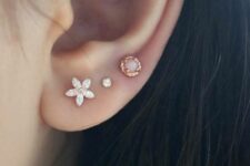 beautiful lobe piercing styling with three rose gold studs is a very chic and girlish idea