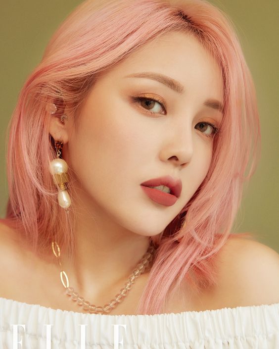 beautiful pastel pink shoulder-length hair with a bit of texture looks very tender and delicate