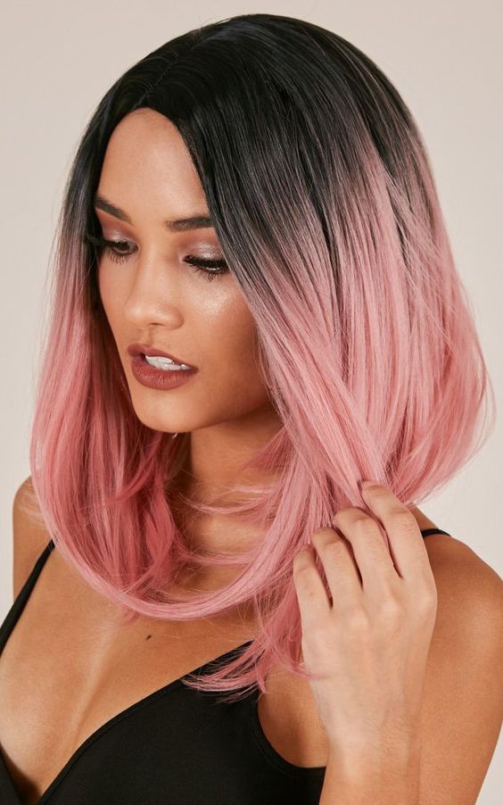 black roots with pastel pink with an ombre effect on a long bob is a very eye-catchy and bodl solution