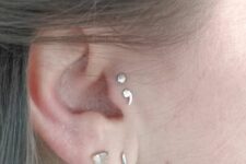 chic ear styling with a double tragus, double lobe piercing done with studs and a hoop is a gorgeous idea
