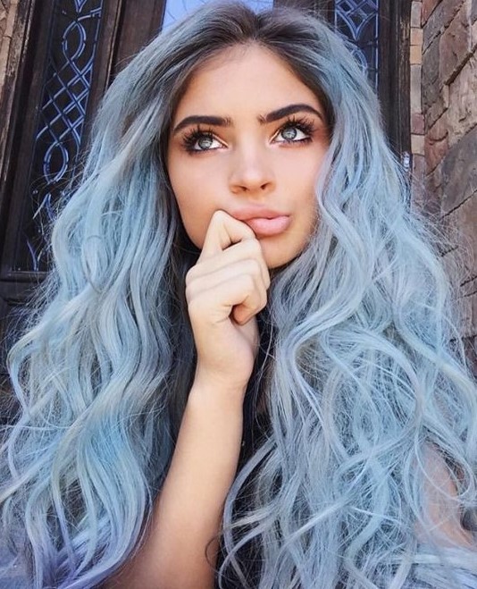 logn pastel blue hair with a darker root and waves is a fantastic idea for a modern mermaid