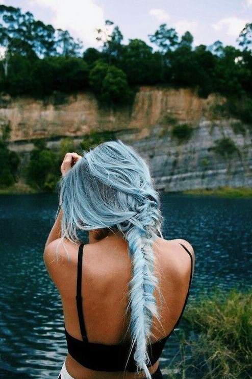 long and textural powder blue hair with a slight ombre effect in a fishtail braid feels like mermaid hair