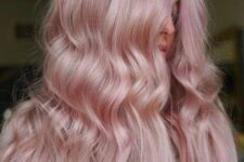 long pastel pink hair with a touch of texture and a bit of waves are a lovely and very romantic combination