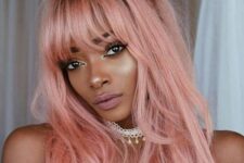 long pastel pink hair with much texture, with bangs and layers is a very beautiful and candy-like idea