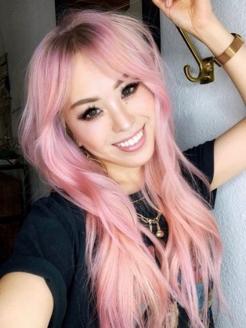 long textural pastel pink hair with layers, side bangs and a darker root is a beautiful and chic idea