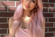long wavy pink hair with much texture and darker roots is a lovely idea for a romantic and girlish look