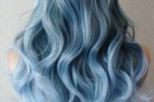 pastel blue hair with a soft ombre effect and waves is a beautiful idea that will catch an eye