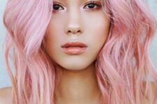 pink shoulder-length hair with a bit of waves and much volume is a gorgeous idea for a fashion-forward girl