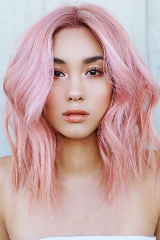 pink shoulder length hair with a bit of waves and much volume is a gorgeous idea for a fashion forward girl