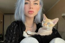 shoulder-length textural pastel blue hair with much volume is a bold and fresh modern idea to try