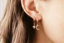 star and moon hoop earrings in a double lobe piercing plus a mid helix piercing done with a gold hoop