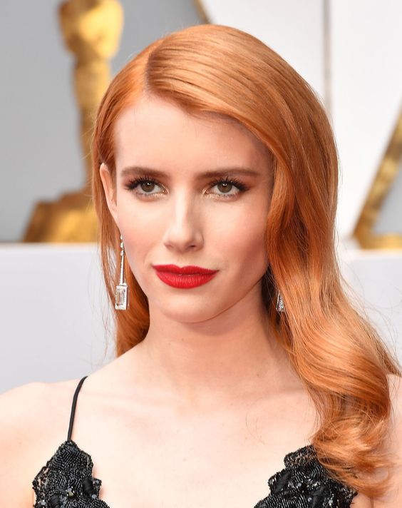 Emma Roberts rocking her beautiful copper red tone, with long shiny locks looks just jaw-dropping
