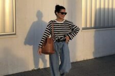 08 a Breton stripe top, blue baggy jeans, neutral trainers, a large brown bag and a black belt are a lovely look for every day