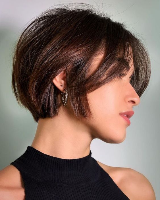 a short and textural bob with bangs in a beautiful chestnut shade is a timeless idea to rock whenever you like